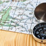 A magnetic compass and topographical map