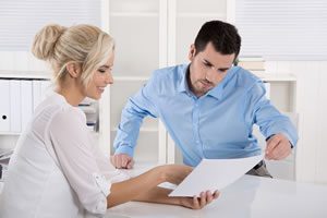 A man and woman going over a plan of action.