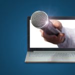 A microphone extending from a laptop screen.