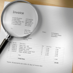 Invoice under a magnifying glass