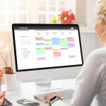professional woman reviews her digital calendar filled with project timelines