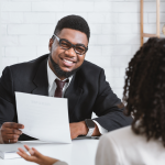 man interviews a prospetive writer for a job