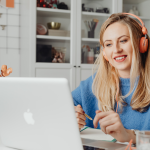 woman wearing headphones offers online client package of services