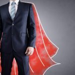 Superhero businessman with red cape drawing on background concept for leadership